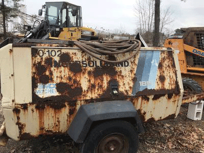 An older Ingersoll Rand P-185 air compressor